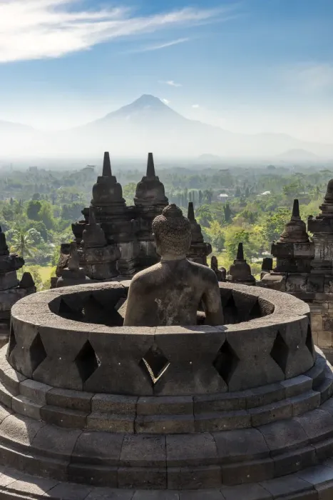 Framed Print : Buddha statue with Mount Merapi in the background, Candi Borobudur buddhist temple Framed Print : Buddha statue with Mount Merapi in the background, Candi Borobudur buddhist temple