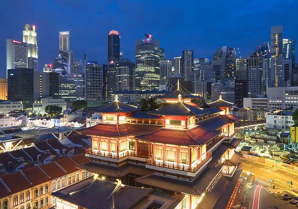 Buddha Tooth Relic Temple and skyscrapers at dusk, Chinatown, Singapore
