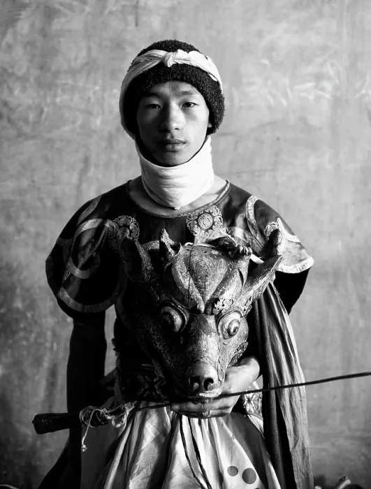 Framed Print : Buddhist monk holding ancient wooden mask and sword during a festival or Tsechu, Gangte Goembe, Bhutan, Asia