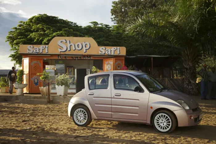 Framed Print : Bujumbura, Burundi. A modern Chinese car on the beach at the weekend Framed Print : Bujumbura, Burundi. A modern Chinese car on the beach at the weekend