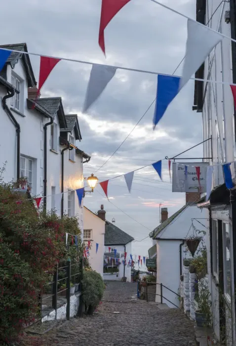 Framed Print : Bunting above the cobbled streets of Clovelly at dawn, North Devon, England. Summer Framed Print : Bunting above the cobbled streets of Clovelly at dawn, North Devon, England. Summer