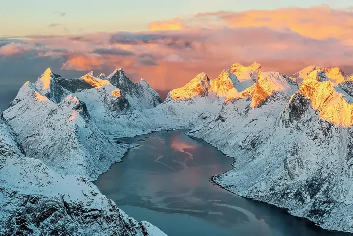 Framed Print : Burning sky at sunset over snowy mountains overlooking the cold arctic sea in winter, Reine, Lofoten Islands, Norway Framed Print : Burning sky at sunset over snowy mountains overlooking the cold arctic sea in winter, Reine, Lofoten Islands, Norway