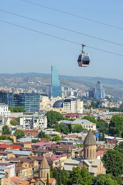 Cable car between Rike Park and the Narikala fortress passes above buildings in central