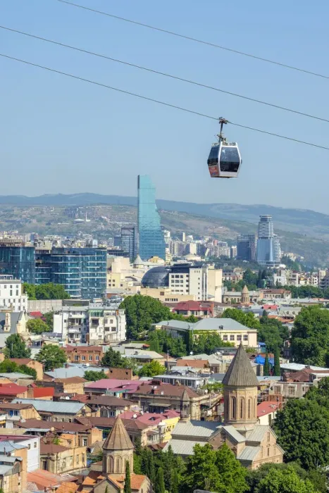 Framed Print : Cable car between Rike Park and the Narikala fortress passes above buildings in central Framed Print : Cable car between Rike Park and the Narikala fortress passes above buildings in central