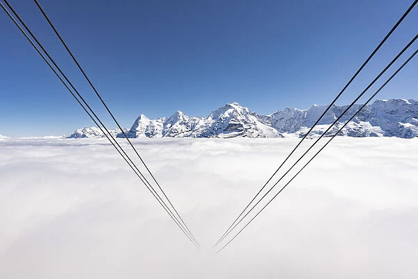 Cableway hidden by fog with Eiger, Monch and Jungfrau, Murren Birg, Berner Oberland, Switzerland