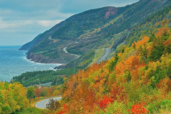 The Cabot Trail along the Gulf of St. Lawrence meanders through the Acadian forest in autumn foliage Cape Breton Highlands National Park, Nova Scotia, Canada
