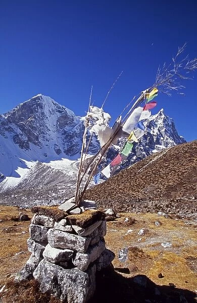 Cairn and prayer flags in the Dzonglha area