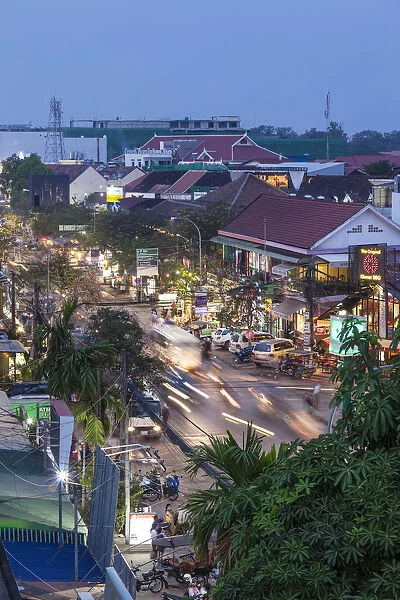 Cambodia, Siem Reap, evening traffic on Sivatha Street, high angle view