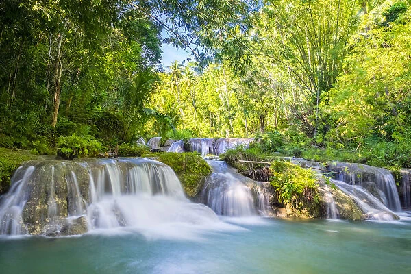 Cambugahay Falls surrounded bu jungle foliage, Lazi, Siquijor Island, Central Visayas