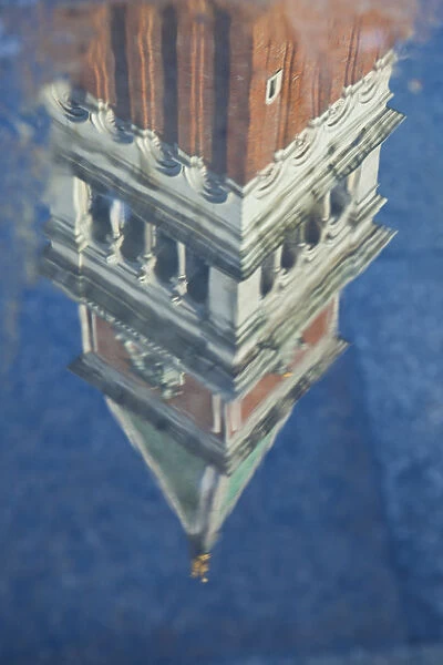 Campanile reflected in puddles in Piazza San Marco (St. Marks Square), Venice, Italy