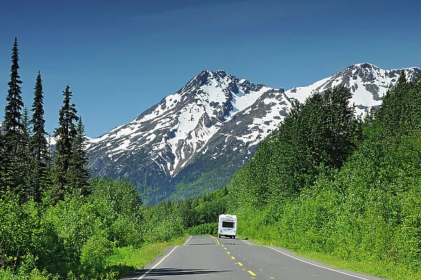 Camper traveling on the Stewart Cassiar Highway and mountains Stewart Cassiar Highway, British Columbia, Canada
