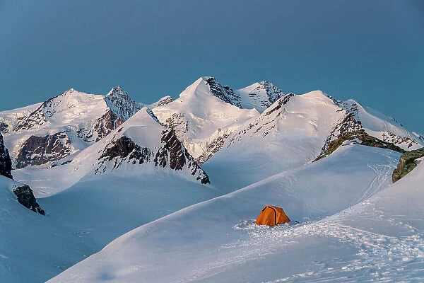Camping with tent surrounded by Monte Rosa glaciers, Gobba di Rollin, Monte Rosa, Aosta Valley, Italy