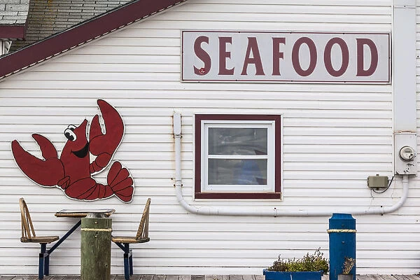 Canada, Prince Edward Island, Summerside, lobster cartoon on wall of seafood restaurant