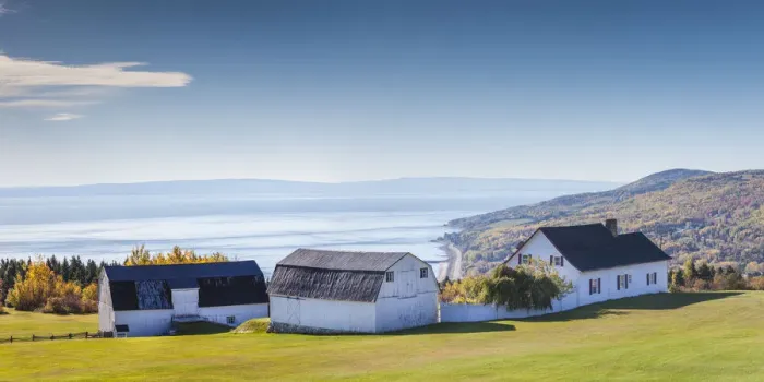 Framed Print : Canada, Quebec, Capitale-Nationale Region, Charlevoix, Sainte Irenee, elevated view of farm and St Framed Print : Canada, Quebec, Capitale-Nationale Region, Charlevoix, Sainte Irenee, elevated view of farm and St