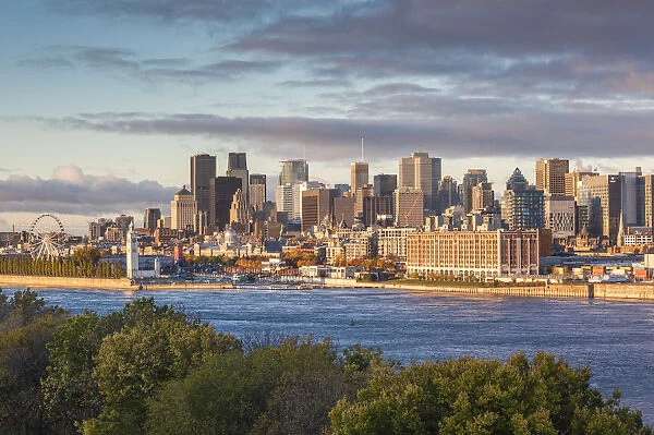 Canada, Quebec, Montreal, elevated city skyline from the St. Lawrence River, dawn