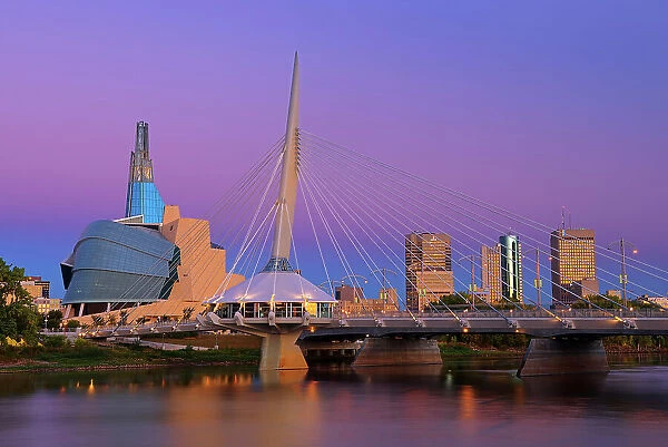 Canadian Museum for Human Rights (CMHR) and the Esplanade Riel Bridge and the Red River at dawn, Winnipeg, Manitoba, Canada