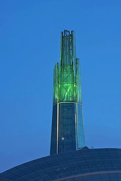 Canadian Museum for Human Rights with the Tower of Hope glowing GREEN for St. Patrick's Day Celebrations, Winnipeg, Manitoba, Canada