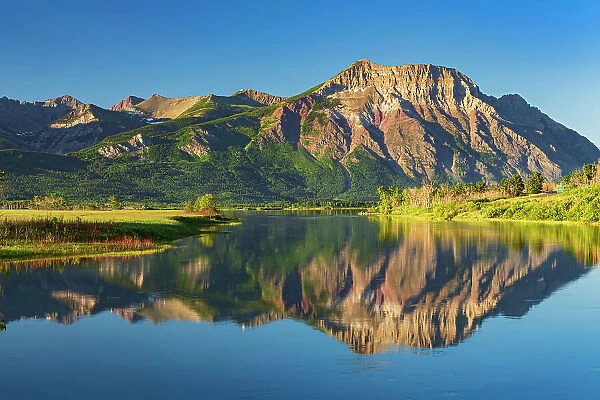 Canadian Rocky Mountains reflected in Lower Waterton Lake Waterton Lakes National Park, Alberta, Canada