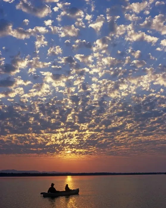 Framed Print : Canoeing under a mackerel sky at dawn on the Zambezi River Framed Print : Canoeing under a mackerel sky at dawn on the Zambezi River