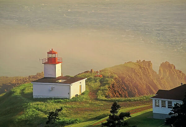 Cape d‚AoOr Lighthouse on the Bay of Fundy in fog Advocate Harbour, Nova Scotia, Canada