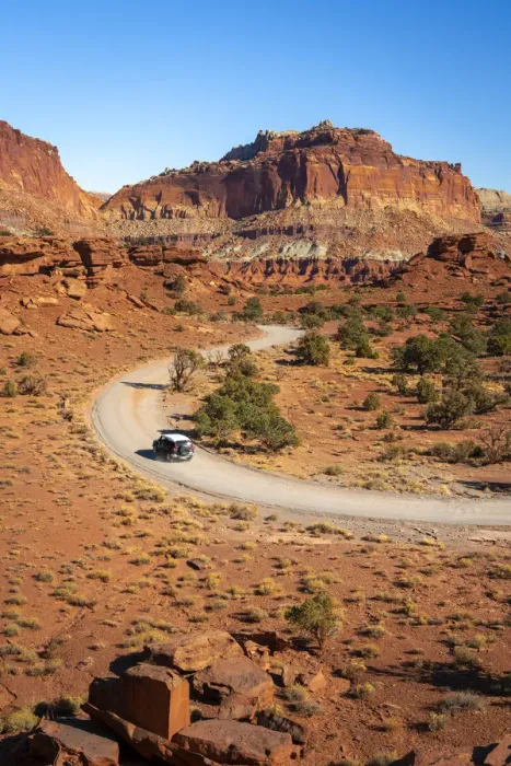 Framed Print : Car driving on dirt road and Whiskey Flat seen from Panorama Point Framed Print : Car driving on dirt road and Whiskey Flat seen from Panorama Point