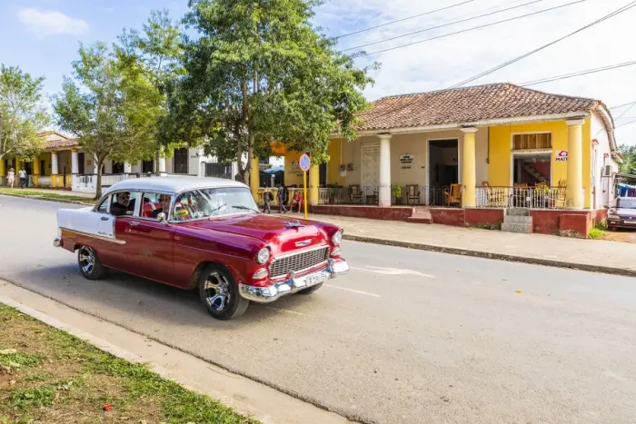 Framed Print : A car driving in a street in Vinales, Pinar del Rio Province, Cuba Framed Print : A car driving in a street in Vinales, Pinar del Rio Province, Cuba