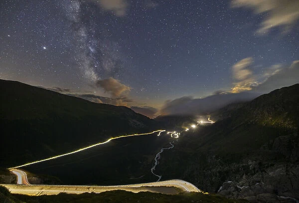 Car lights and milkyway from Furkapass to Grimselpass during summer, Uri, Canton Vallese