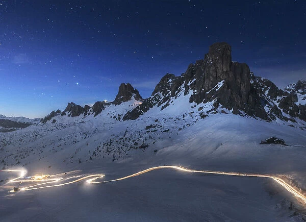 Car trail at dusk over the Giau Pass in the Dolomites, Italy