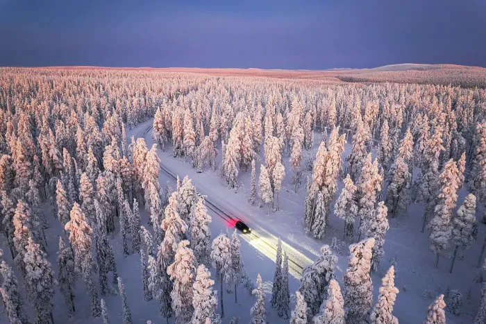 Framed Print : Car traveling on icy road crossing the winter forest covered with snow from above, Lapland, Finland Framed Print : Car traveling on icy road crossing the winter forest covered with snow from above, Lapland, Finland