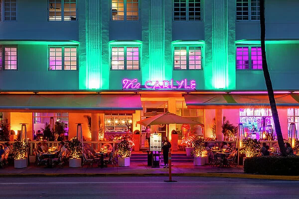 The Carlyle Hotel & Restaurant on Ocean Drive at dusk, Miami, United States of America