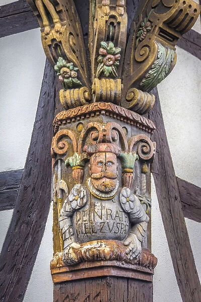 Carving on half-timbered house in the old town of Kronberg, Taunus, Hesse, Germany