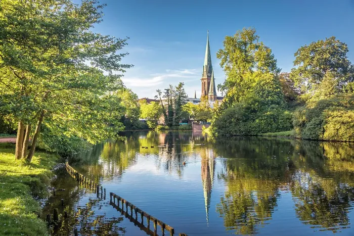 Framed Print : Castle pond in the castle garden with a view of St. Lamberti Church, Oldenburg, Oldenburger Land, Lower Saxony, Germany Framed Print : Castle pond in the castle garden with a view of St. Lamberti Church, Oldenburg, Oldenburger Land, Lower Saxony, Germany