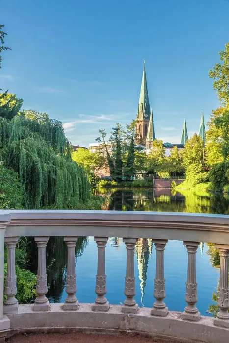 Framed Print : Castle pond in the castle garden with a view of St. Lamberti Church, Oldenburg, Oldenburger Land, Lower Saxony, Germany Framed Print : Castle pond in the castle garden with a view of St. Lamberti Church, Oldenburg, Oldenburger Land, Lower Saxony, Germany