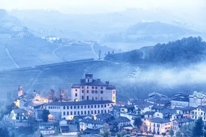Framed Print : Castle and village of Barolo during a foggy dusk. Barolo wine region, Langhe, Piedmont