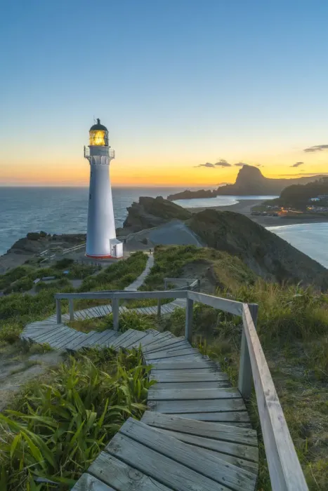Framed Print : Castlepoint lighthouse lit at dusk. Castlepoint, Wairarapa region, North Island, New Framed Print : Castlepoint lighthouse lit at dusk. Castlepoint, Wairarapa region, North Island, New