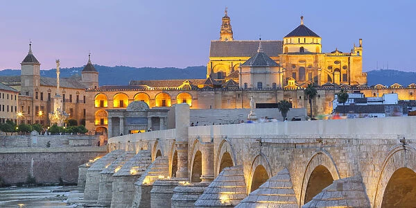 Cathedral (Mezquita) and Roman bridge at sunset, Guadalquivir river, Cordoba, Andalusia