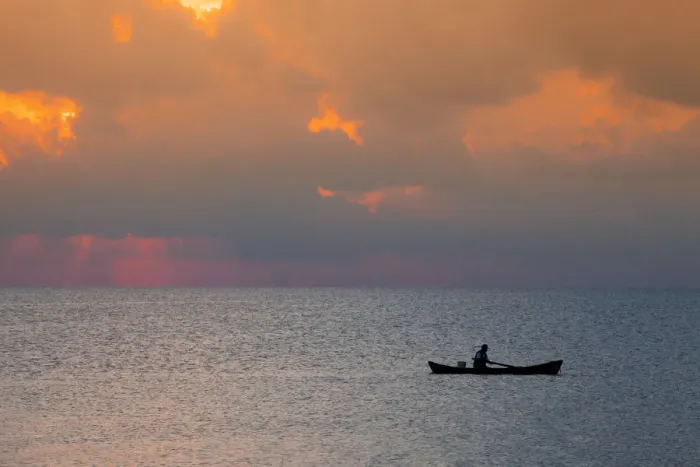 Framed Print : Central America, Belize, Ambergris Caye, San Pedro, a fisherman in front of stormy Framed Print : Central America, Belize, Ambergris Caye, San Pedro, a fisherman in front of stormy