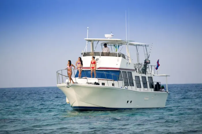 Framed Print : Central America, Belize, models on a motor yacht on the cayes