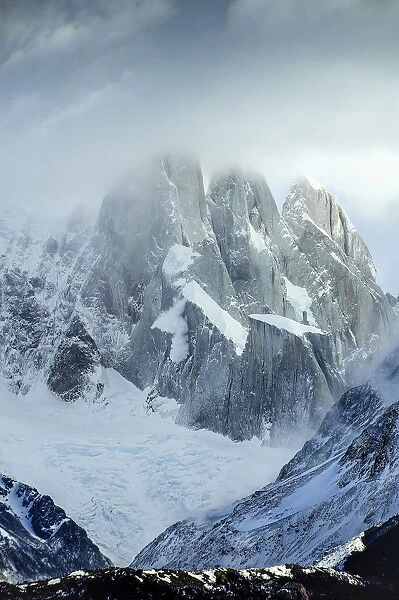 The Cerro Torre Mountain into the clouds taken near Laguna Torre into the Glacier