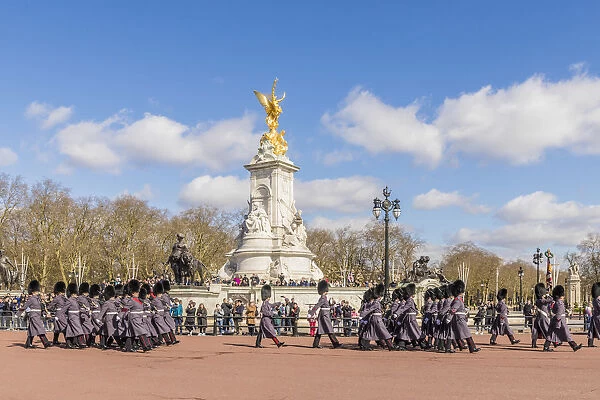 Changing of the Guard by Victoria Memorial, Buckingham Palace, London, England