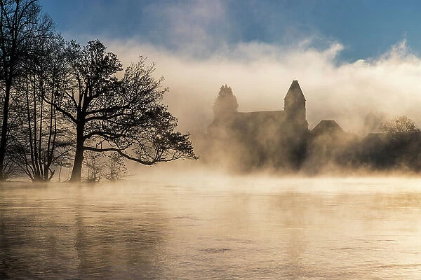 Chapelle des Penitents in the morning mist, Beaulieu-sur-Dordogne, Correze, Nouvelle-Aquitaine, France