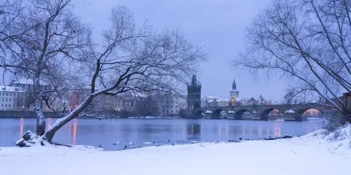 Framed Print : Charles Bridge and Old Town Bridge Tower against snowy sky in winter, Prague, Bohemia