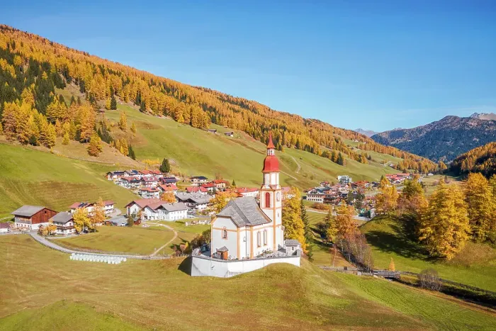 Framed Print : The charming village of Obernberg am Brenner with the iconic church of Sankt Nikolaus on an autumn day, Obernberg am Brenner, Innsbruck Land, Tyrol, Austria, Europe