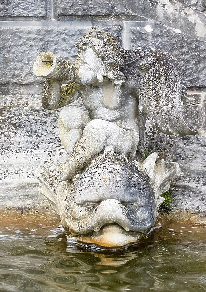 A cherub statue in the fountain at the Loggia, Italian Garden, Hever Castle, Kent, England