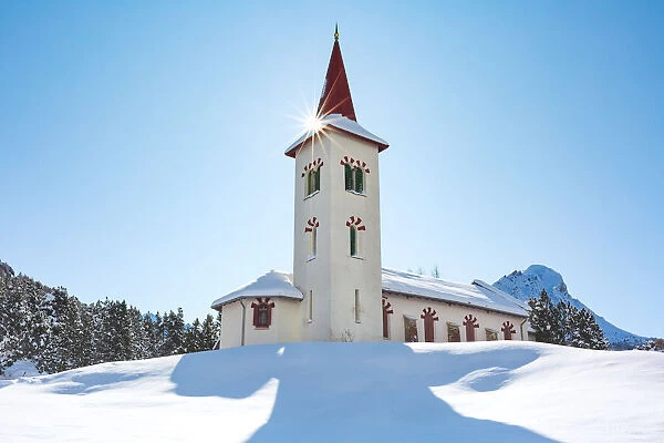 Chiesa Bianca of Maloja in Engadin in winter, Graubunden, Switzerland