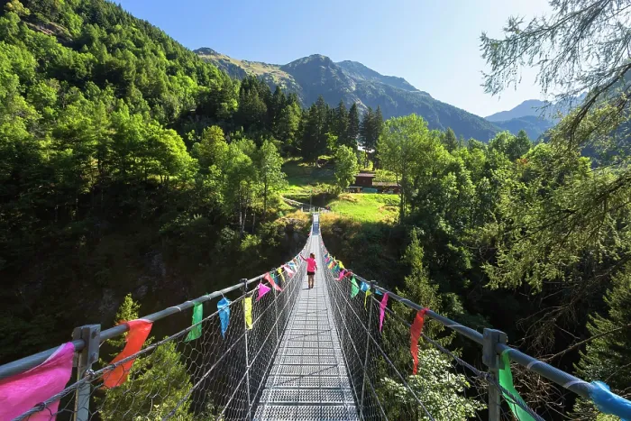 Framed Print : A child crosses the tibetan bridge of Fraciscio, Campodolcino, Spluga valley, Sondrio province, Lombardy, Italy (MR)