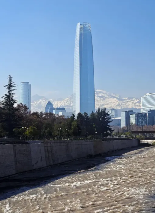 Framed Print : Chile, Santiago, View over Mapocho River towards the high raised buildings with Costanera