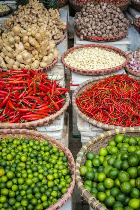 Framed Print : Chili peppers, limes, ginger and garlic for sale at Đồng Xuan