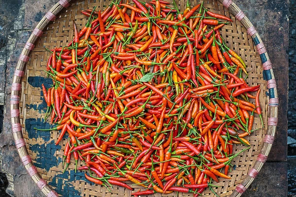 Chili peppers for sale in basket at Dong Xuan Market, Hoan Kiem District, Old Quarter