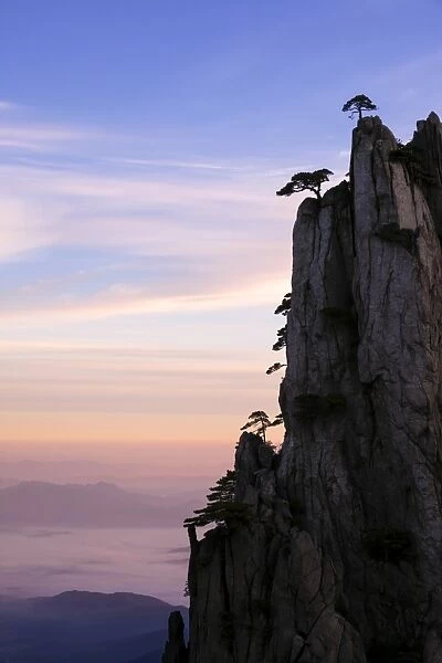 China, Anhui, Huangshan. Sunrise over the famous Huangshan (yellow) mountains